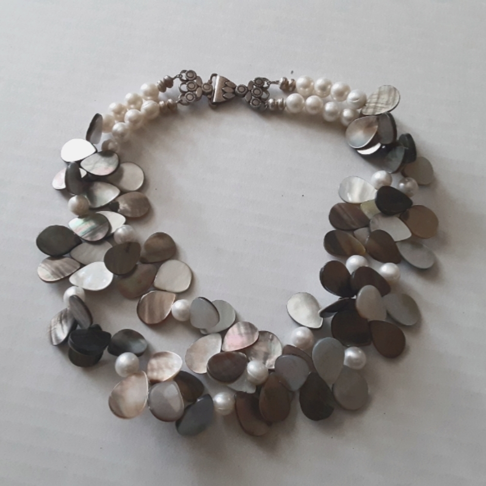 Pearl and mother of pearl necklace with sterling silver clasp.